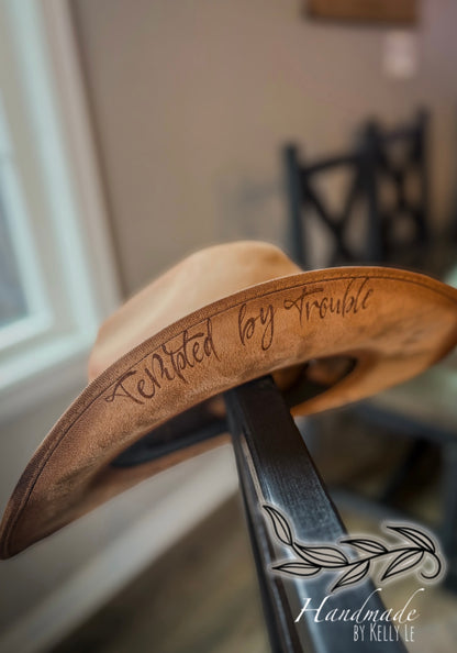 Heart crown cowboy “tempted by trouble”